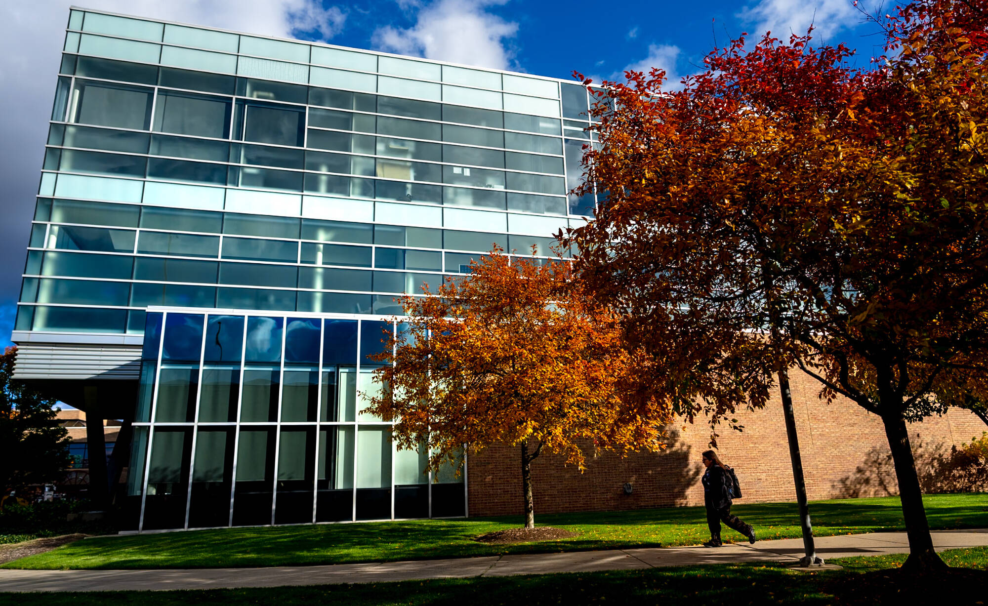 Students walk past the Kennedy Hall of Engineering building on City Campus in downtown Grand Rapids.